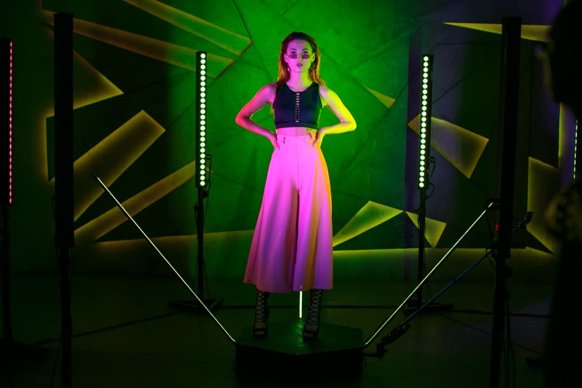 360 photo booth with green and pink neon lights at a brand activation event in Barcelona