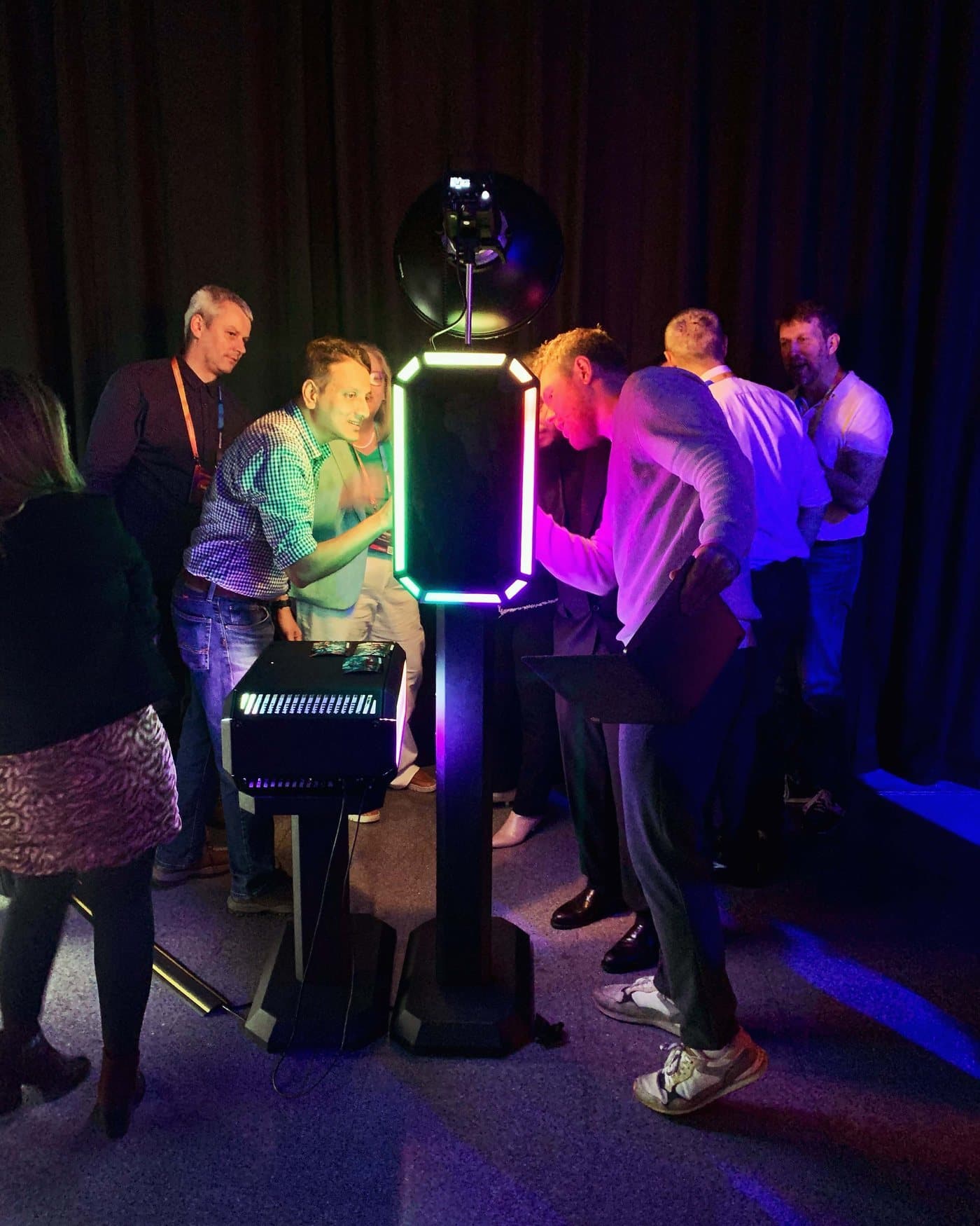 Guests interacting with the LED photo booth at an event