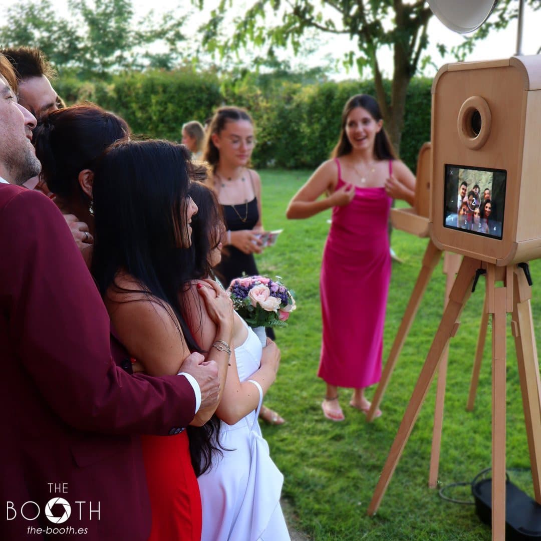 Group of guests looking at their photo strip at the vintage booth